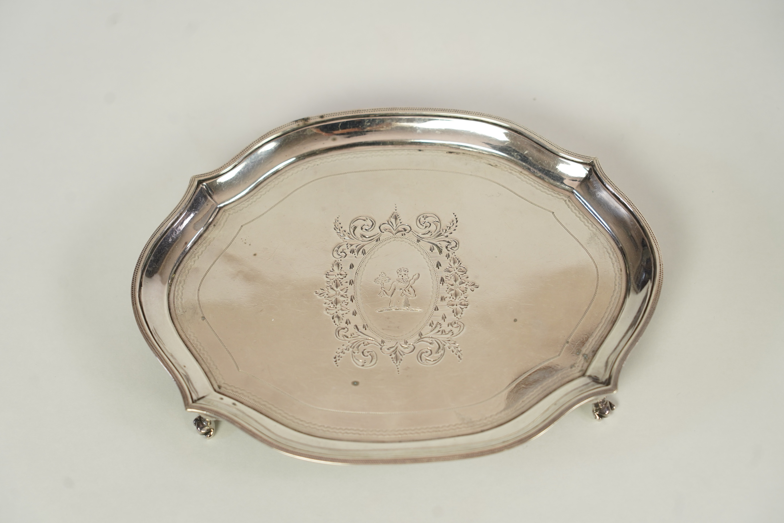 A George III silver teapot and matching stand, by Soloman Hougham